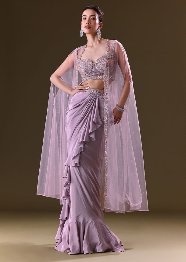 Mauve Ruffled Drape Skirt With Embroidered Blouse And Net Cape