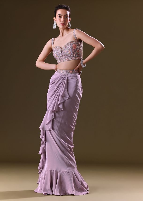 Mauve Ruffled Drape Skirt With Embroidered Blouse And Net Cape