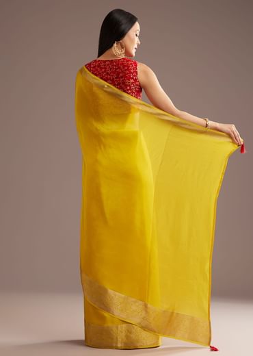 Mustard Yellow Crepe Silk Saree With Zari Border And Contrast Blouse