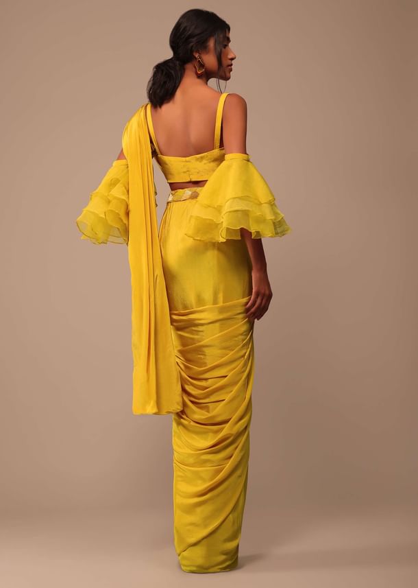 Mustard Yellow Crepe Saree With Ruffle Layered Blouse And Embroidered Belt Mustard Yellow Crepe Saree With Ruffle Layered Blouse And Embroidered Belt