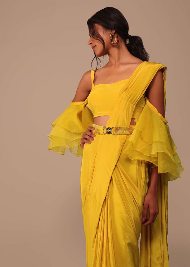 Mustard Yellow Crepe Saree With Ruffle Layered Blouse And Embroidered Belt Mustard Yellow Crepe Saree With Ruffle Layered Blouse And Embroidered Belt