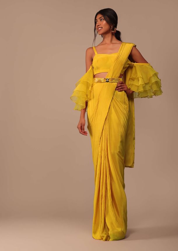 Mustard Yellow Crepe Saree With Ruffle Layered Blouse And Embroidered Belt Mustard Yellow Crepe Saree With Ruffle Layered Blouse And Embroidered Belt