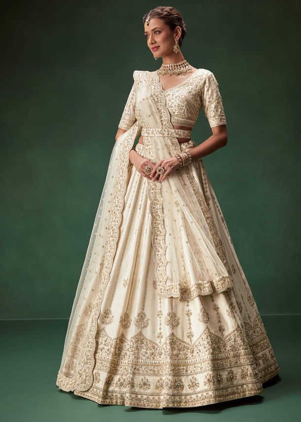 Off White Bridal Lehenga Set With Boat Neck Blouse And Regal Zari Work