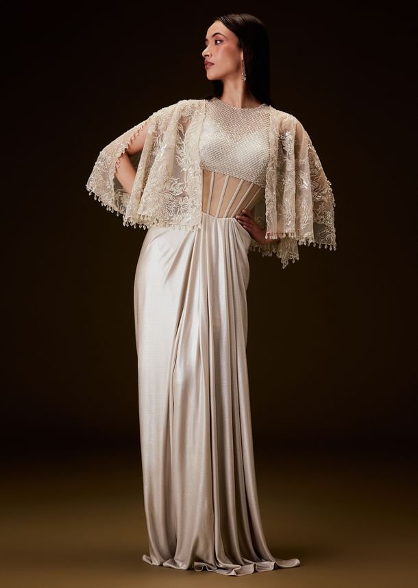 Off White Corset Gown With Sheer Waistline And Embroidered Cape Off White Corset Gown With Sheer Waistline And Embroidered Cape