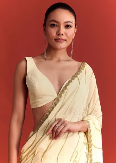 Off White Saree In Chinnon With Cutdana Embroidery