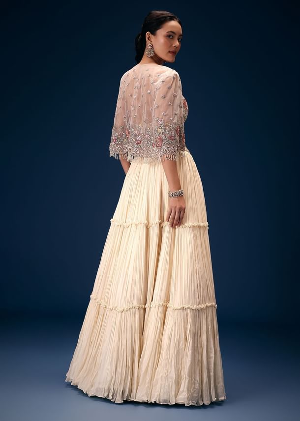 Off White Tiered Lehenga With Embroidered Corset Blouse And Embroidered Cape