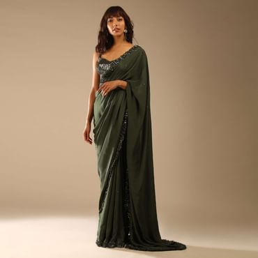 Olive Green Saree In Crepe With Sequins Ruffle On The Border, Sequins Blouse With Front Cut Out And Embellished Belt
