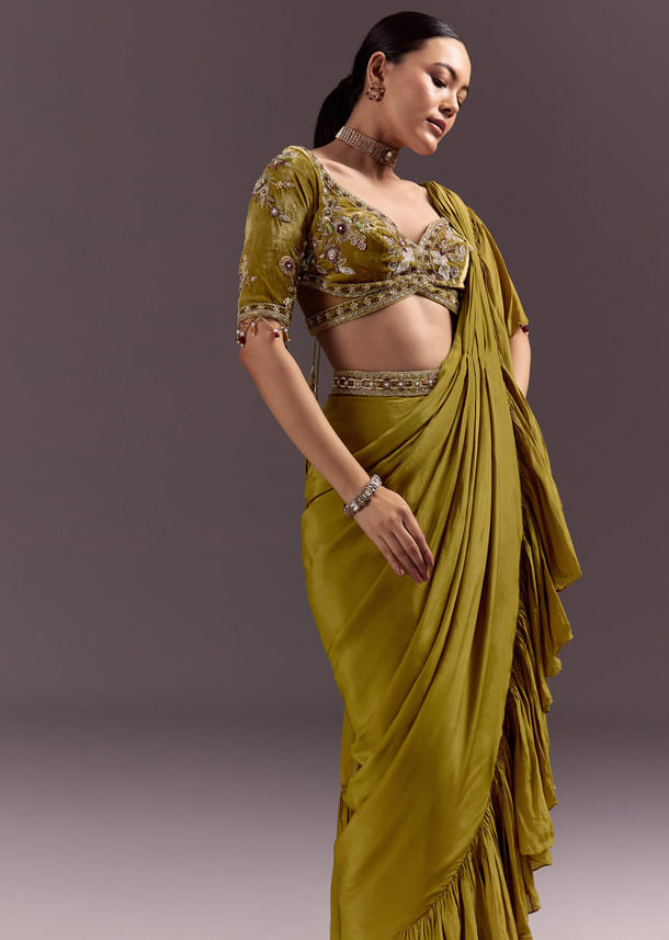 Olive Green Velvet Saree With Frilled Pallu And Heavy Embroidered Blouse Olive Green Velvet Saree With Frilled Pallu And Heavy Embroidered Blouse