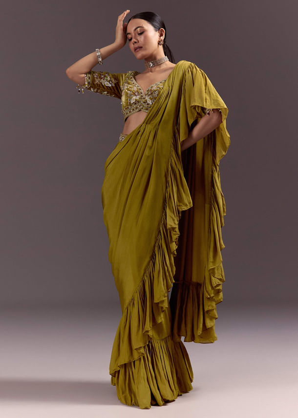 Olive Green Velvet Saree With Frilled Pallu And Heavy Embroidered Blouse Olive Green Velvet Saree With Frilled Pallu And Heavy Embroidered Blouse