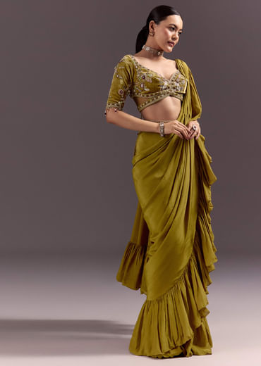 Olive Green Velvet Saree With Frilled Pallu And Heavy Embroidered Blouse
