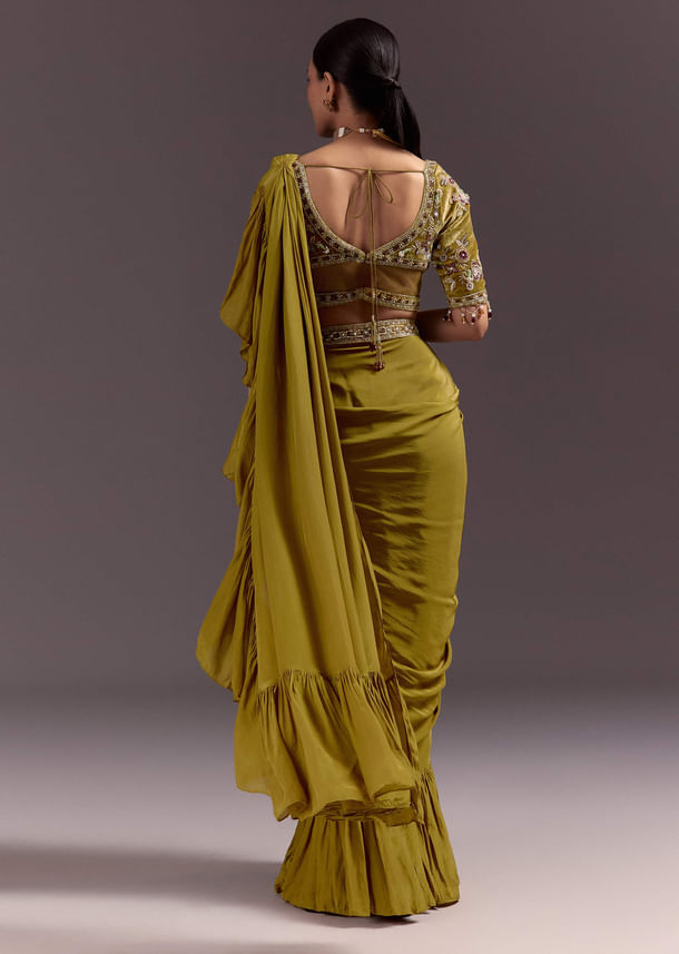 Olive Green Velvet Saree With Frilled Pallu And Heavy Embroidered Blouse Olive Green Velvet Saree With Frilled Pallu And Heavy Embroidered Blouse