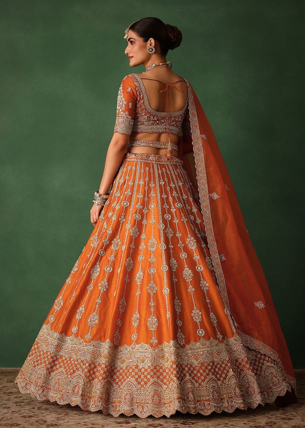 Orange Lehenga Set In Raw Silk With Hand Embroidered Motifs