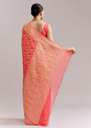 Peach Georgette Woven Saree With Floral Jaal And Heavy Border