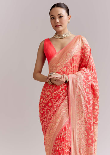 Peach Georgette Woven Saree With Floral Jaal And Heavy Border