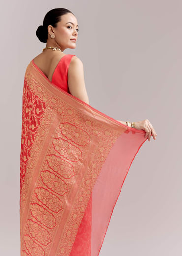 Peach Georgette Woven Saree With Floral Jaal And Heavy Border