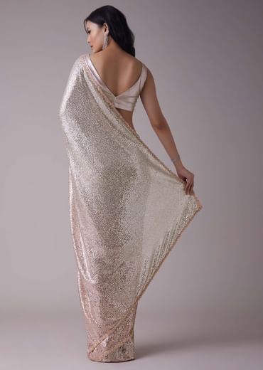 Peach Pink And Silver Toned Sequins Saree With An Embellished Border