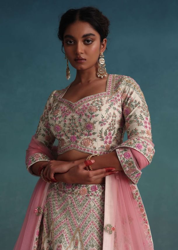 Pearl White Embroidered Bridal Lehenga In Raw Silk With Floral Hand Embroidery