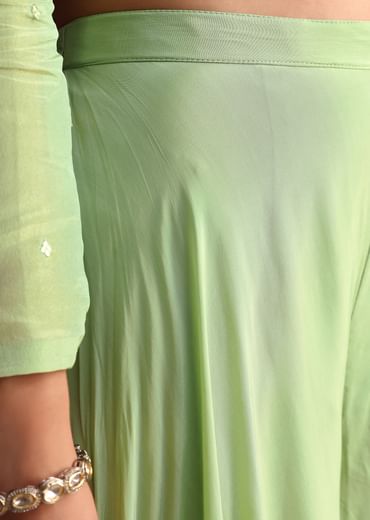Embrace elegance with our Green Embroidered Tissue Crop Top And Palazzo Suit