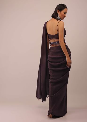 Plum Saree With Moti And Cut Dana Fringes Detailing On The Pallu And A Spaghetti Straps Crop Top With An Embroidered Belt In Fringes