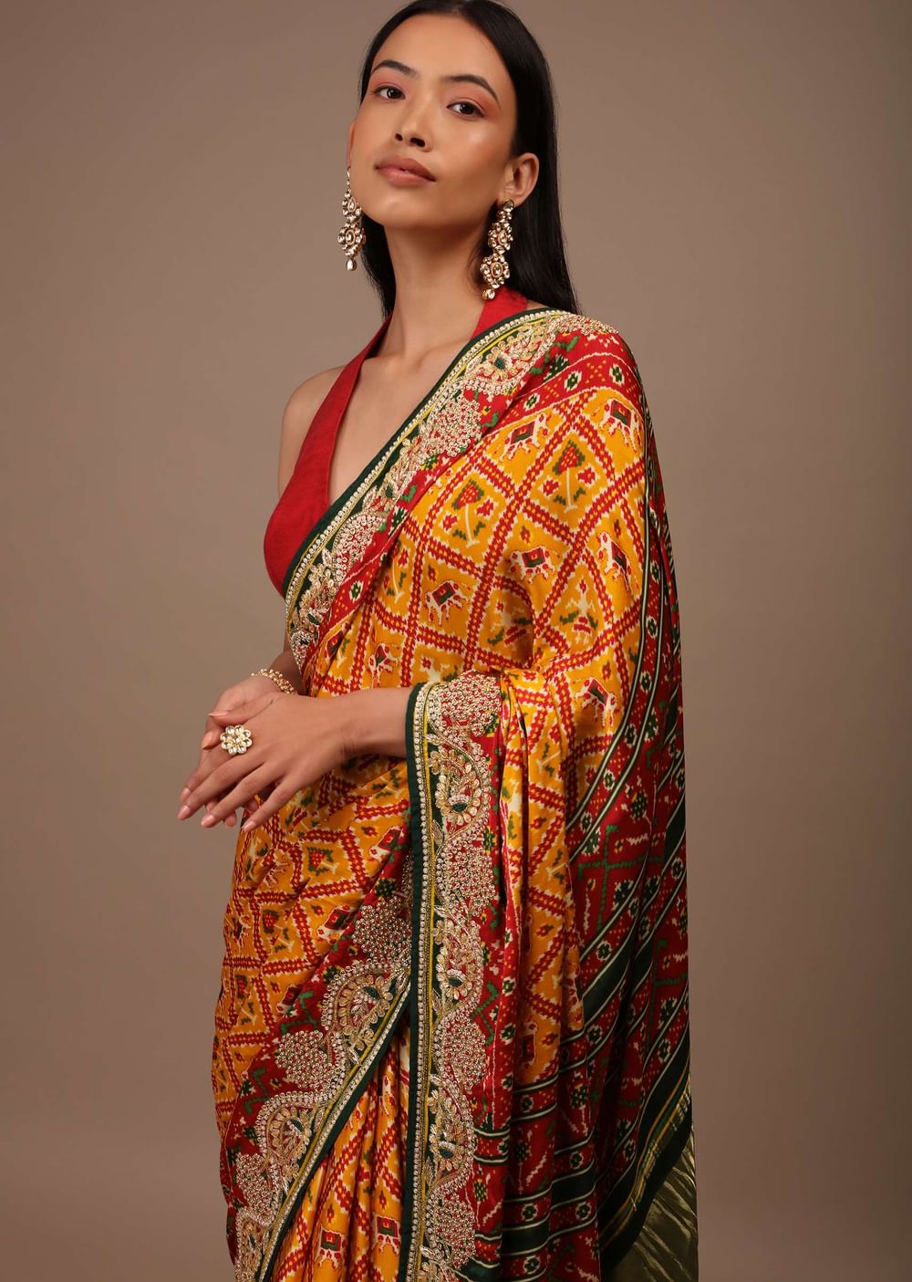 Radiant Yellow Saree In Satin With Multi Colored Patola Print And Gotta Patti Embroidered Border