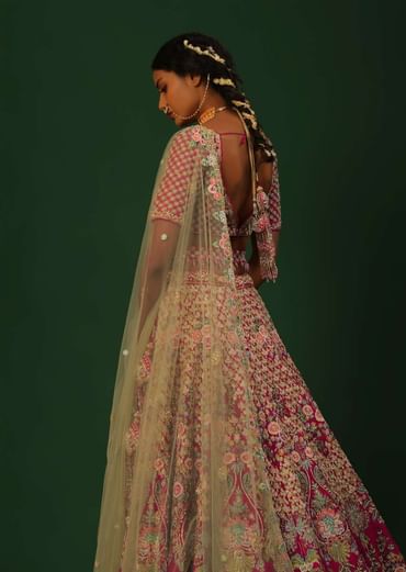 Rani Pink Lehenga Choli In Raw Silk With Heavy Embroidered Kalis Using Colorful Resham And Cut Dana In Floral Motifs Online - Kalki Fashion