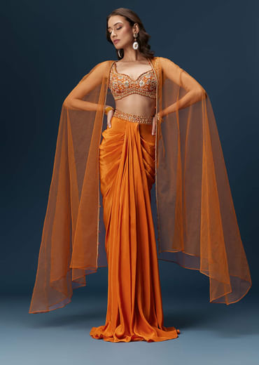 Rust Dhoti Skirt Set With Embellished Blouse And Tassel Net Dupatta