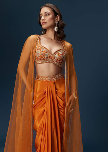 Rust Dhoti Skirt Set With Embellished Blouse And Tassel Net Dupatta