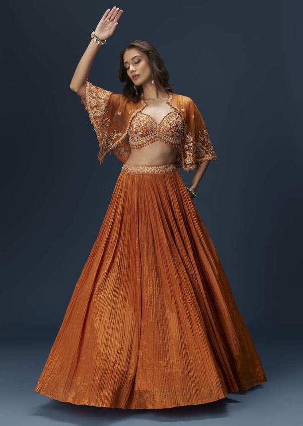 Rust Orange Embroidered Lehenga With Dramatic Cape And Blouse Rust Orange Embroidered Lehenga With Dramatic Cape And Blouse