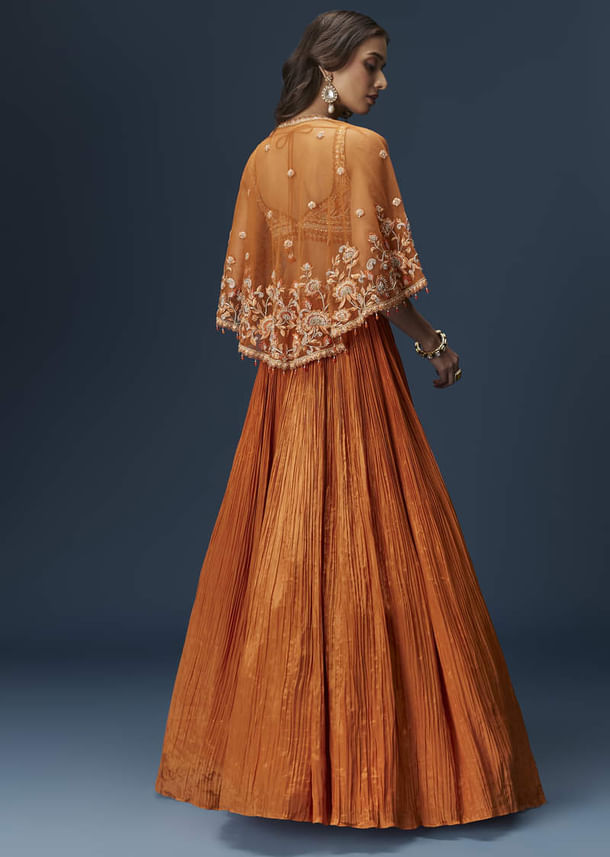 Rust Orange Embroidered Lehenga With Dramatic Cape And Blouse Rust Orange Embroidered Lehenga With Dramatic Cape And Blouse