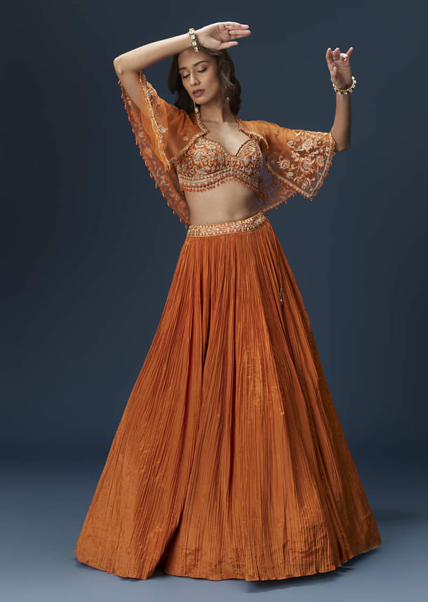 Rust Orange Embroidered Lehenga With Dramatic Cape And Blouse Rust Orange Embroidered Lehenga With Dramatic Cape And Blouse