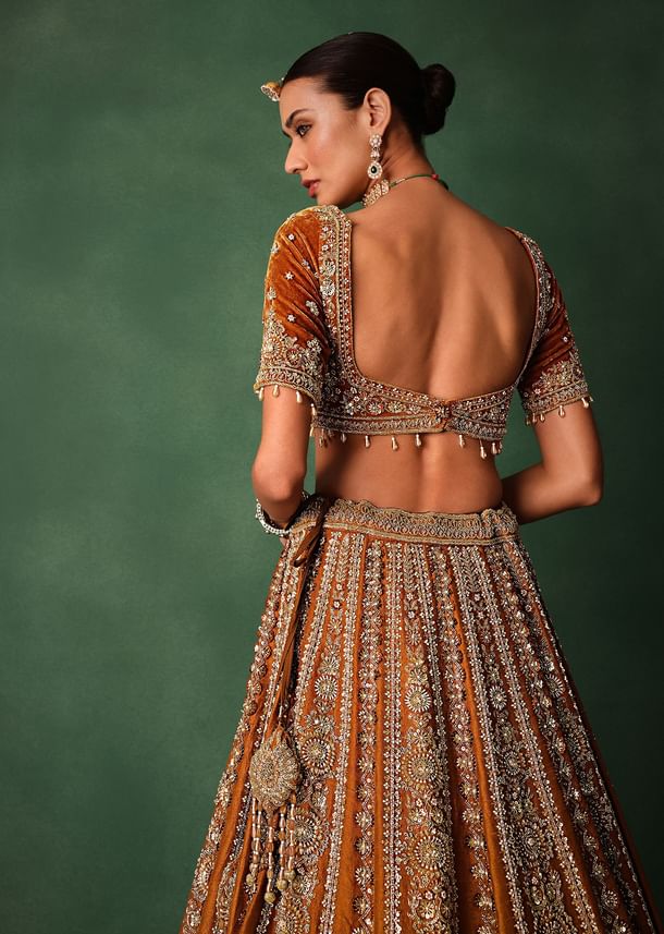 Rust Embroidered Bridal Lehenga With Deep Neckline Blouse And Dupatta