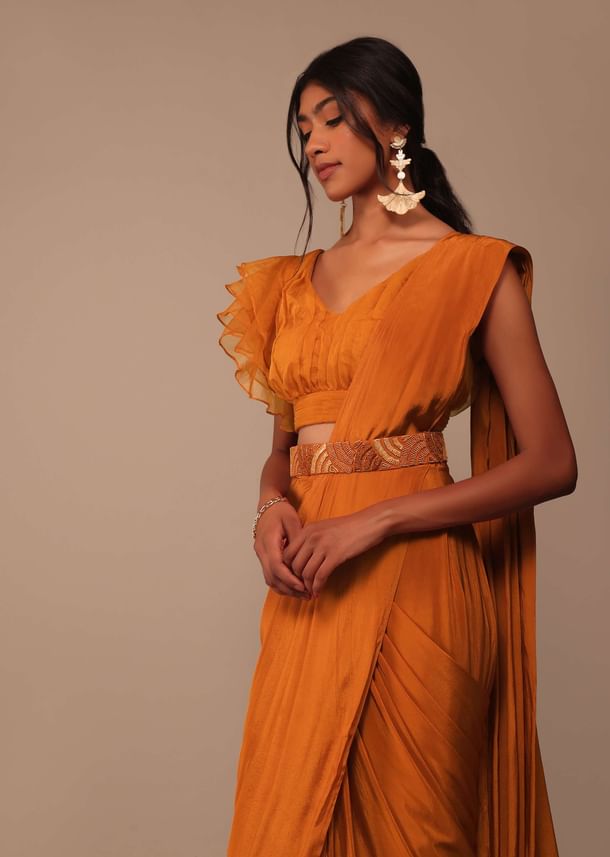 Rust Orange Saree With Fancy Ruffle Blouse And Embroidered Belt Rust Orange Saree With Fancy Ruffle Blouse And Embroidered Belt