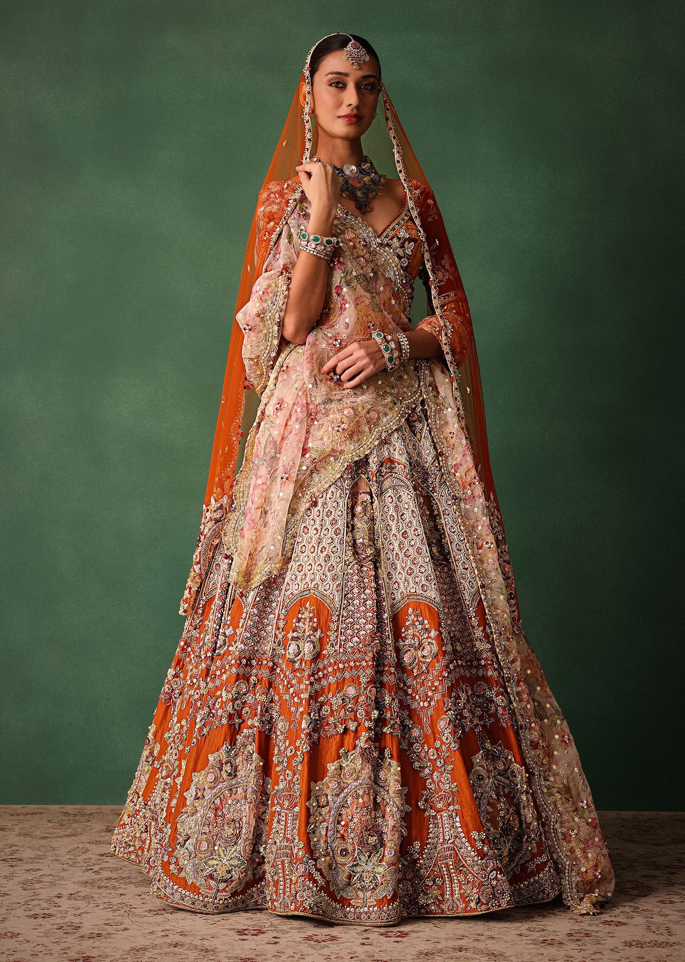 Rust V Neck Blouse With Heavy Jaal Cutdana Work Bridal Lehenga And Heavy Dupatta