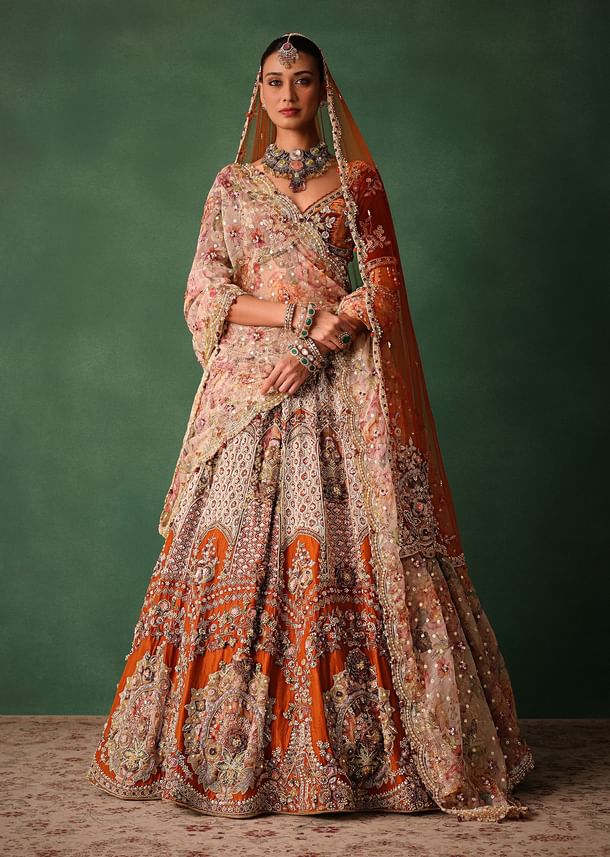 Rust V Neck Blouse With Heavy Jaal Cutdana Work Bridal Lehenga And Heavy Dupatta