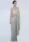 Sage green shimmer georgette saree adorn with moti scattered and heavy stone embroidered border only on Kalki