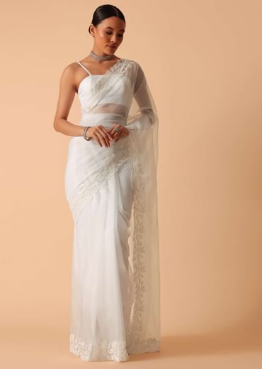 White Saree In Organza With Floral Motif Border And Unstitched Blouse Piece White Saree In Organza With Floral Motif Border And Unstitched Blouse Piece