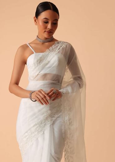 White Saree In Organza With Floral Motif Border And Unstitched Blouse Piece White Saree In Organza With Floral Motif Border And Unstitched Blouse Piece