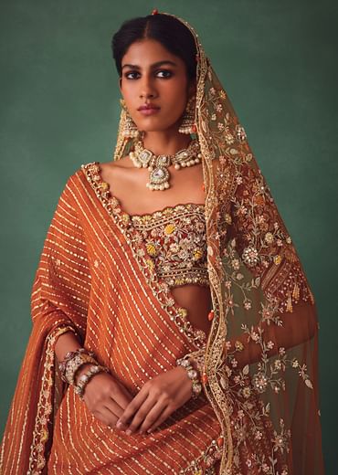 Rust Raw Silk Bridal Lehenga With Buti Work Dupatta