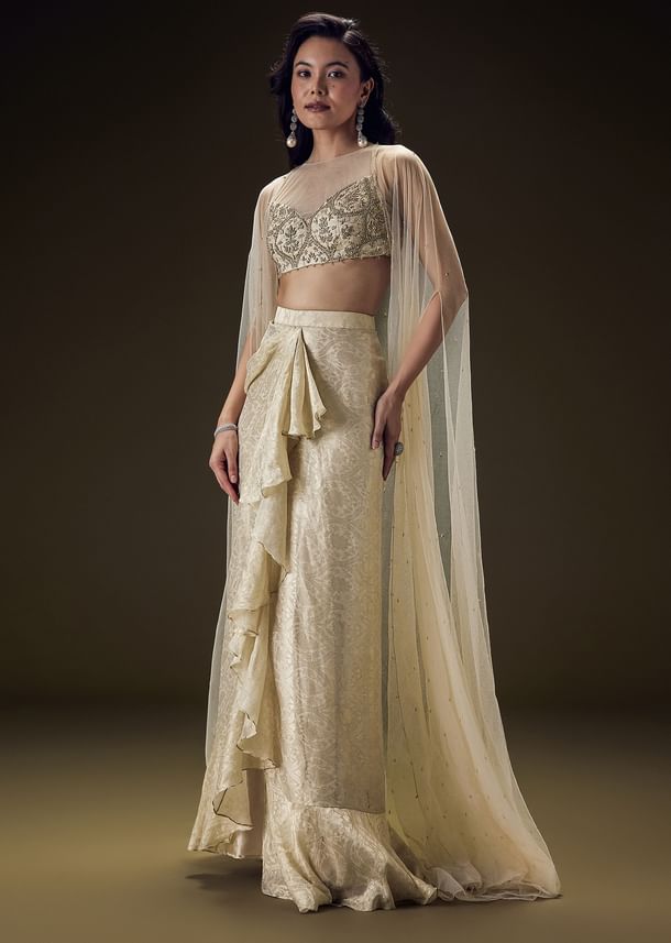 Beige Zardozi Embroidered Blouse With Brocade Drape Skirt And Net Cape