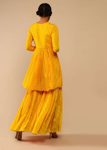 Honey Yellow Sharara Suit In Crepe With Bandhani And Lehariya Print Paired With Moti Embroidered Peplum Kurti