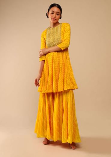 Honey Yellow Sharara Suit In Crepe With Bandhani And Lehariya Print Paired With Moti Embroidered Peplum Kurti