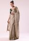 Silver Zari Tissue Saree With Embroidered Emerald Green Stitched Blouse