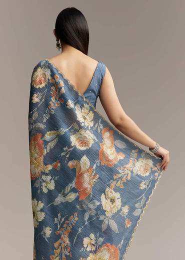 Teal Blue Tissue Saree With Floral Print And Embroidered Border