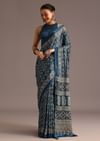 Teal Satin Ajrakh Print Saree With Mirror Embellished Border And Pallu