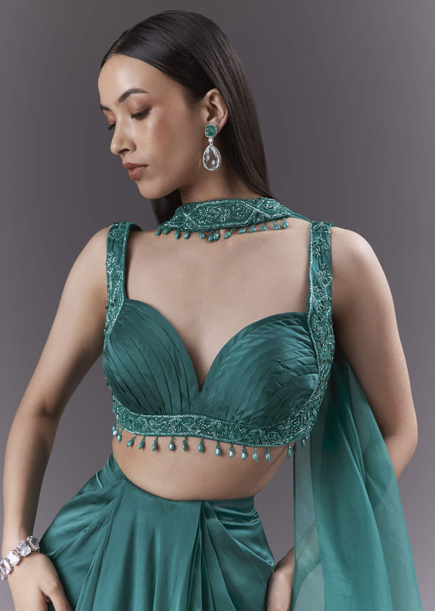 Teal Satin Crop Top And Drape Skirt Set With Heavy Embroidery Teal Satin Crop Top And Drape Skirt Set With Heavy Embroidery