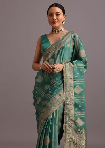 Teal Zari Work Satin Silk Woven Saree And Brocade Border
