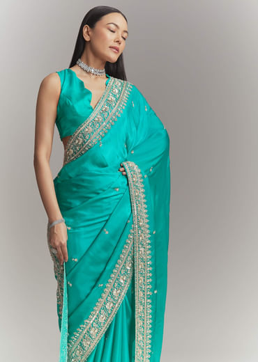 Turquoise Blue Satin Embroidered Saree With Heavy Hand Embroidery