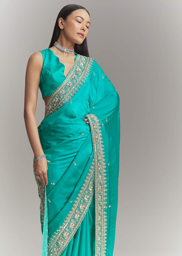 Turquoise Blue Satin Embroidered Saree With Heavy Hand Embroidery