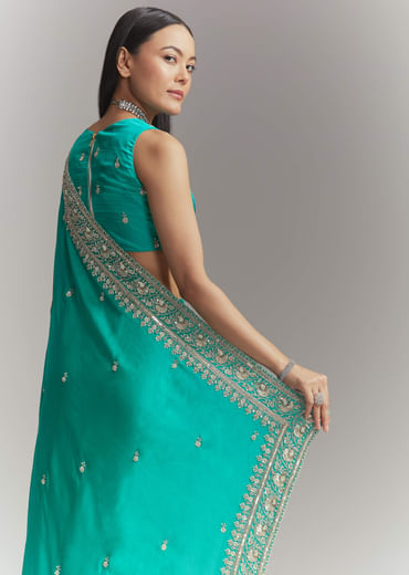 Turquoise Blue Satin Embroidered Saree With Heavy Hand Embroidery
