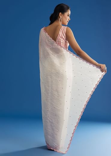 White Crepe Silk Saree With Mirror Scallop Border And Pink Contrast Blouse